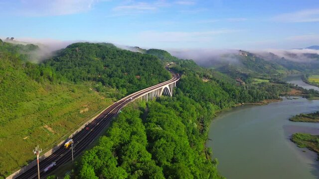 Panoramic highway Milan-Rome, Italy, during a summer day.
Aerial shot of a scenic road with many lanes, overlooking the Tiber River.