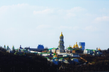 Scenic spring view of famous Kyiv's hills against blue sky. Scenic landscape of ancient Kyiv Pechersk Lavra. It is a historic Orthodox Christian monastery. Kyiv, Ukraine