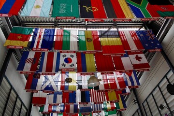 Flags from around the world hanging between buildings