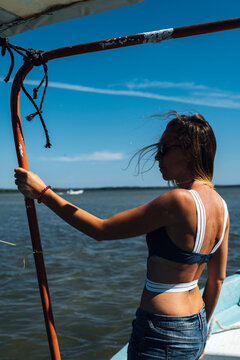 Middle aged woman and swim suit travelling in motorboat on sunny day at caribbean, Travel, Mexico, Lifestyle, quality of life, Deceleration
