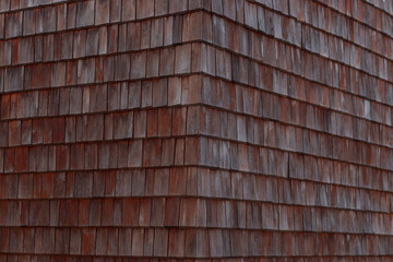 Wooden tiles on the roof, close-up. texture.