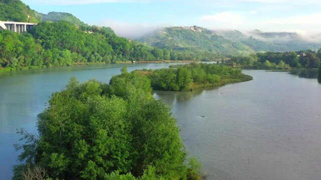 Tevere Farfa Nature Reserve, Nazzano, Lazio, Italy.
The river valley of the Tiber north of Rome. Aerial view with drone in 4K