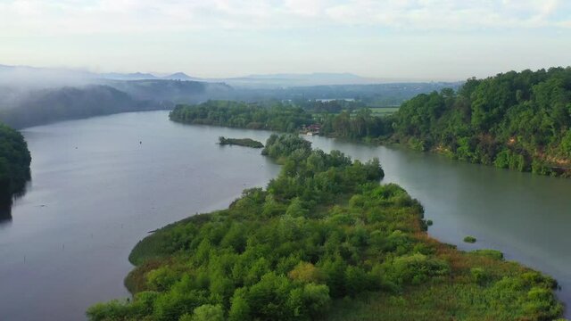 Tevere Farfa Nature Reserve, Nazzano, Lazio, Italy.
The river valley of the Tiber north of Rome. Aerial view with drone in 4K