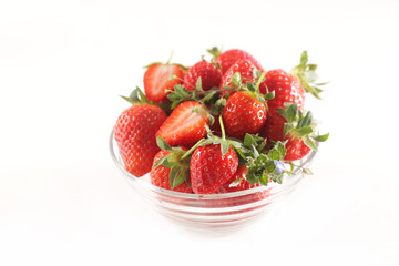 bowl of fresh strawberries on white background