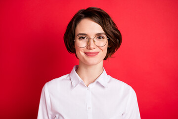 Photo portrait of happy business woman wearing glasses formal wear smiling isolated vibrant red color background