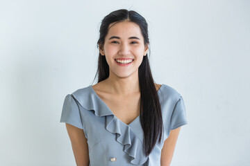 Delighted Asian woman smiling for camera