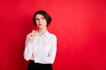 Photo portrait of curious business woman keeping glasses thoughtful looking copyspace isolated...