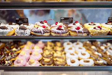 A show case full of delicious donuts in a candy shop. Pastry, dessert, sweet
