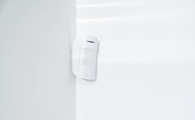 motion sensor oin the white corner. device that tracks the movement of objects. It is used to...