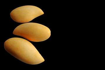 Mangoes fruit on black background