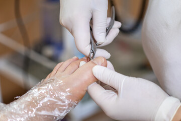 Female foot in process of pedicure procedure stock photo