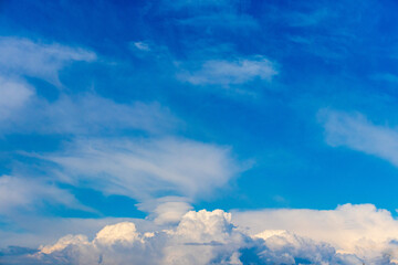 The blue sky with clouds as the blue backdrop in the air The nature of the blue sky with clouds in the morning, the blue sky with white, soft clouds