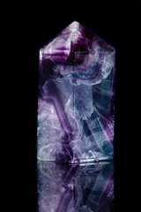Macro mineral stone Fluorite crystal on a black background