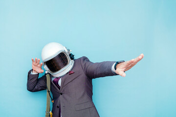 Businessman with astronaut helmet euphoric celebrating