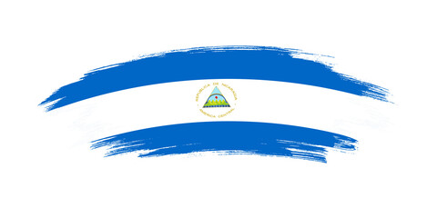 Obraz premium Artistic grunge brush flag of Nicaragua isolated on white background