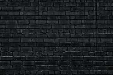 Black dirty brick wall texture. Old rough brickwork backdrop. Gloomy dark grey block masonry grunge background