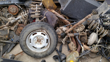 Uralsk, Kazakhstan (Qazaqstan), 31.07.2016: old car parts, auto parsing market, old bent disc...