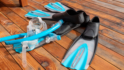 Snorkeling equipment on wooden floor