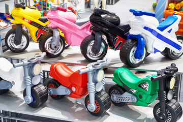 Fototapeta na wymiar Plastic bicycles in toy store