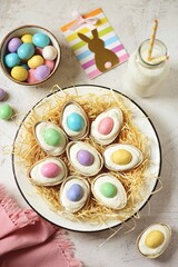 Fototapeta na wymiar Easter dessert of chocolate eggs with cottage cheese, white chocolate, gelatin and malted eggs. 