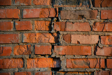 Stonewall of red bricks background building