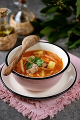 Soup with veal, cabbage, turnips, onions, carrots, potatoes and tomatoes.