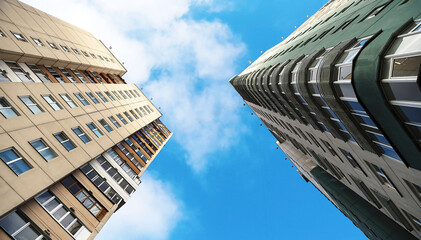 Fototapeta na wymiar Two high-rise residential buildings against the sky.
