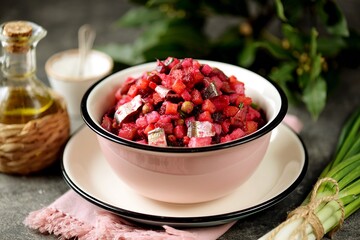 Traditional salad Vinaigrette with salted fish, beets, potatoes, carrots, pickles, onions and vegetable oil.