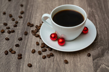 Coffee Cup with Christmas decorations on wooden table