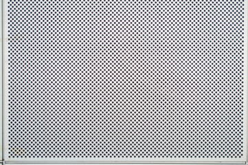 A hole on a white metal background