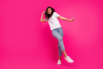 Fototapeta na wymiar Full length body size view of pretty cheerful girl dancing having fun rest relax isolated over vivid pink fuchsia color background