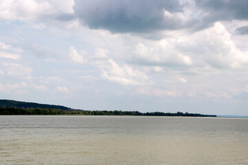 A panoramic view on a summer day of Lake Balaton and the jutting cape into the lake.