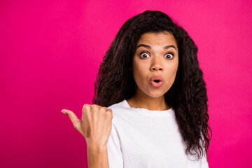 Portrait of attractive amazed girl demonstrating offer pout lips wow isolated over vivid pink...