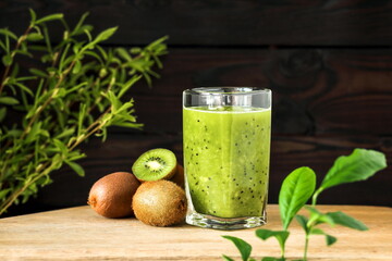 A glass of green smoothie made from kiwi fruit. Home cooking, vegetarian diet