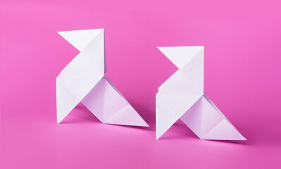 simple retro origami pigeons with pink background