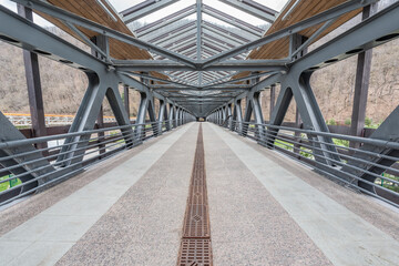 Interior of the metal bridge above the road.