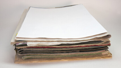 neat little stack of newspapers and magazines