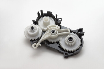inkjet printer paper feeder mechanical drive. four external spur gear wheels, with different gear...