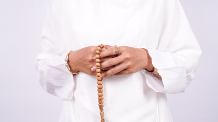 Asian women muslim pray on a white background