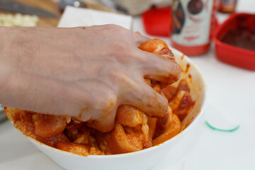 A man cook pork meat with a sauce. Cooking Concept