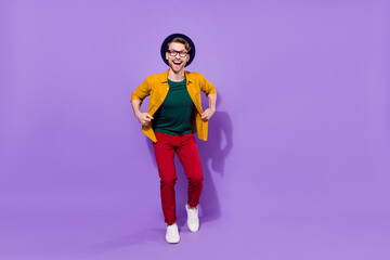 Full length body size view of attractive cheerful funky guy dancing good mood isolated over bright violet purple color background