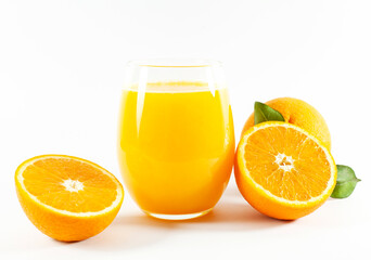 Glass of fresh orange juice with fruits cut in half and sliced with green leaf isolated on white background, clipping path