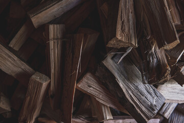 Winter preparation. Stacking Firewood. Pile of firewood loggs. Firewood background.