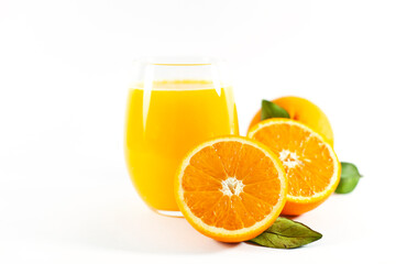 Glass of fresh orange juice with fruits cut in half and sliced with green leaf isolated on white background, clipping path