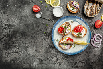 Sprats sandwiches on plate, Danish cuisine. banner, menu recipe place for text, top view