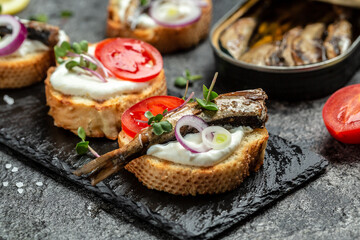 Sandwich with sprats. Sprat in oil, Danish cuisine. Food recipe background. Close up