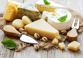 Different types of cheese with basil and nuts