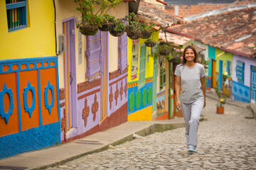 young woman walking in traditional Colombian village