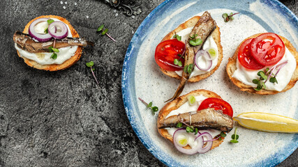 Sandwich with sprats. Sprat in oil, Danish cuisine. Long banner format, top view