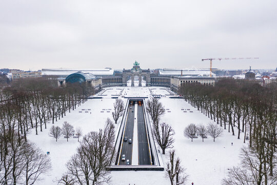 Aerial view of the Tunnel of Cinquantenaire with the Arcade du Cinquantenaire in background at wintertime, a stately triple arch monument, Brussel, Belgium.